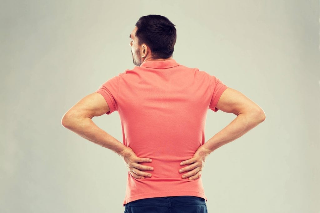 Man suffering from bulging disc in lower back schedules surgery consultation in Florida