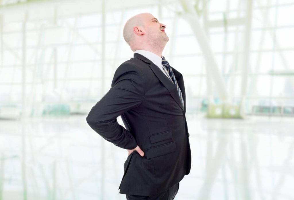 Man suffers back pain caused by a car accident